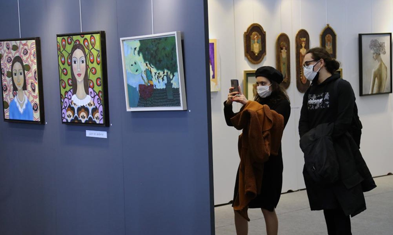 People wearing face masks visit an international contemporary art fair in Ankara, Turkey, on March 30, 2021.  Photo: Xinhua