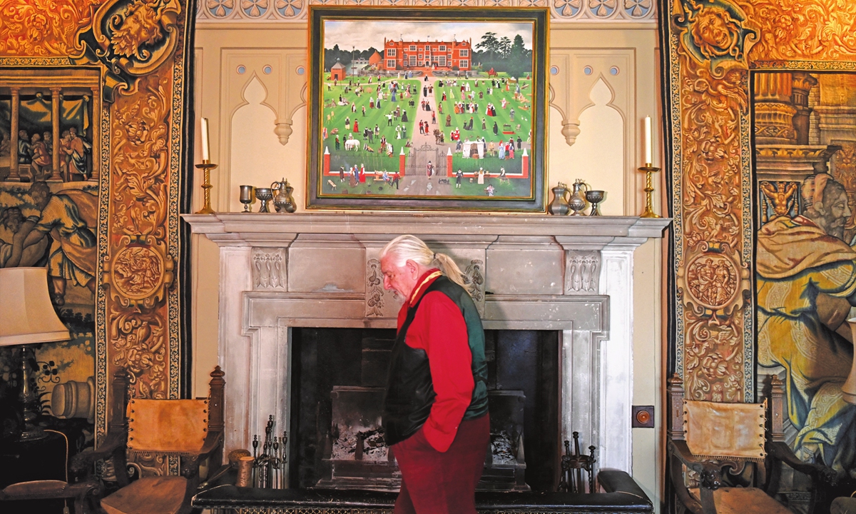 Patrick Phillips poses inside his historic stately home near Bury St Edmunds. Photo: AFP