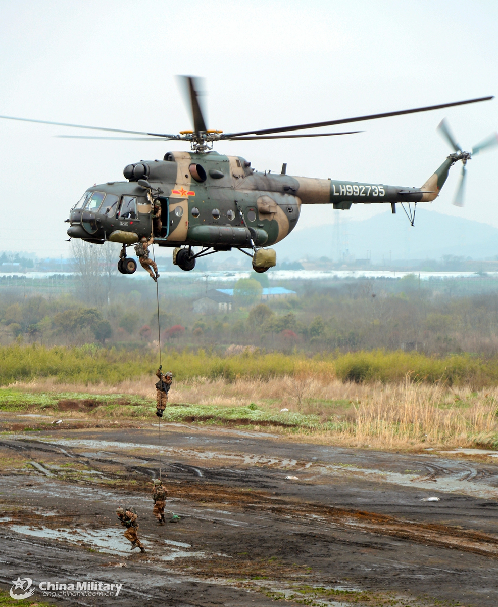 Soldiers assigned to an army aviation brigade under the PLA 72nd Group Army rappel from a transport helicopter during a fast-roping training exercise which aims to beef up the troops' coordinated operational capability on March 20, 2021. Photo: China Military Online