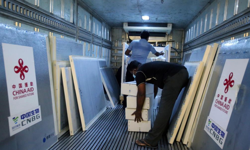 Workers unload Sinopharm COVID-19 vaccines at the Bandaranaike International Airport in Colombo, Sri Lanka, March 31, 2021. A batch of Sinopharm vaccines arrived in Sri Lanka from China on Wednesday as part of a donation by the Chinese government to the island nation.Photo:Xinhua