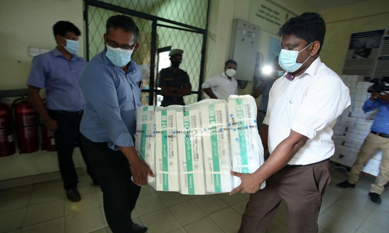 Workers transport Sinopharm COVID-19 vaccines at the Bandaranaike International Airport in Colombo, Sri Lanka, March 31, 2021. A batch of Sinopharm vaccines arrived in Sri Lanka from China on Wednesday as part of a donation by the Chinese government to the island nation.Photo:Xinhua