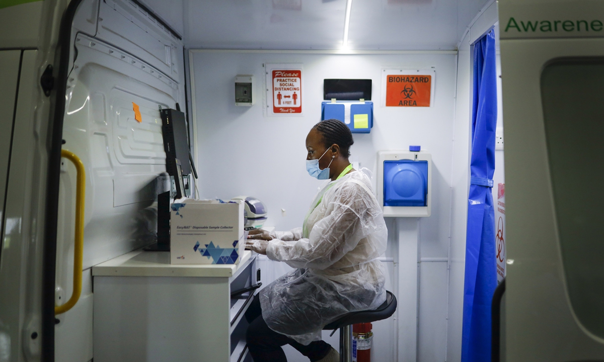 A medical worker at a computer inside a mobile coronavirus testing unit in Johannesburg, South Africa, on January 5. Photo: VCG