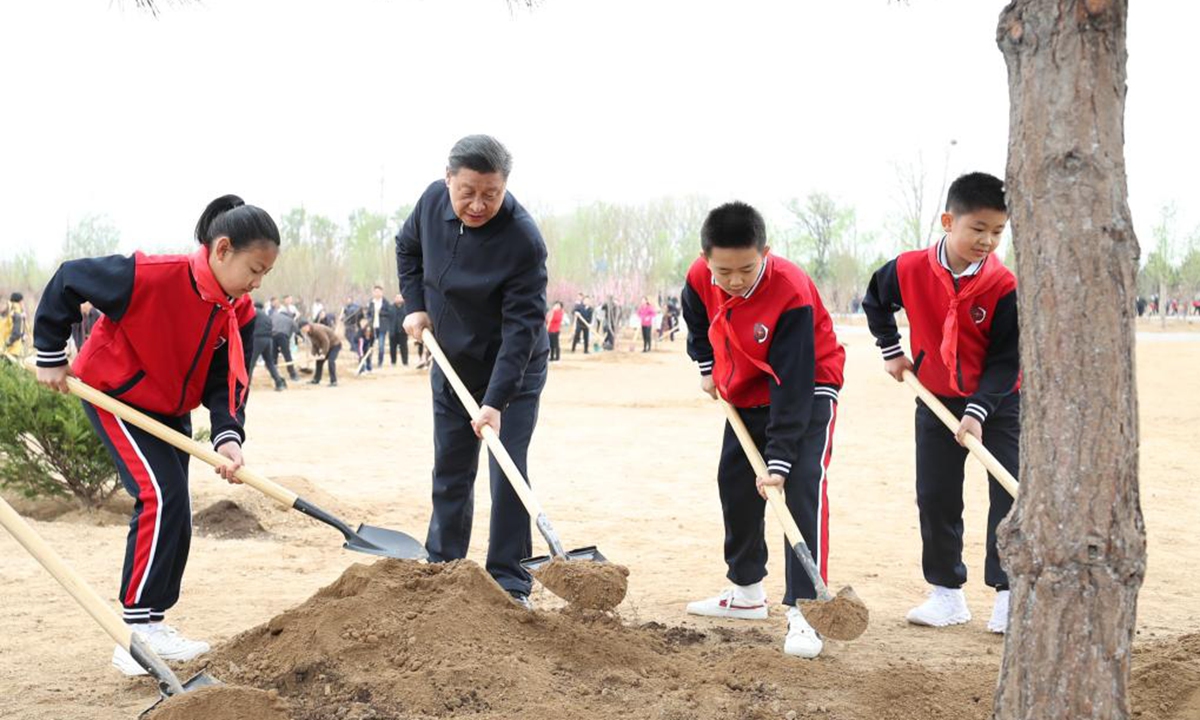 Chinese President Xi Jinping, also general secretary of the Communist Party of China Central Committee and chairman of the Central Military Commission, plants a tree during a tree-planting activity in Chaoyang District in Beijing, capital of China, April 2, 2021. The activity was also attended by other leaders including Li Keqiang, Li Zhanshu, Wang Yang, Wang Huning, Zhao Leji, Han Zheng and Wang Qishan. (Xinhua/Huang Jingwen)