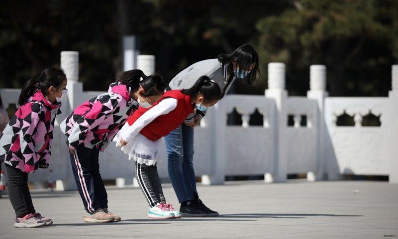 People bow to the monument at the Chinese People's Volunteers (CPV) martyrs' cemetery in Shenyang, capital of northeast China's Liaoning Province, April 4, 2021.(Photo: Xinhua)