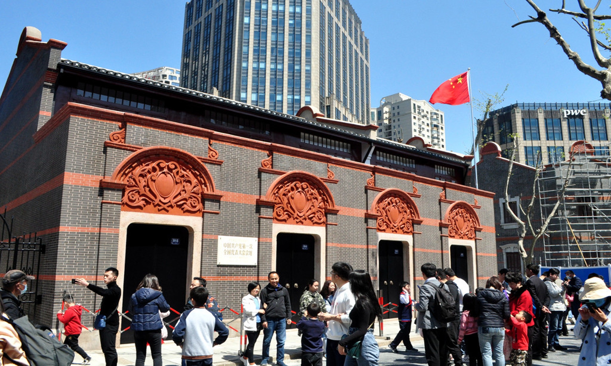 Tourists take photos in front of the site of the first National Congress of the Communist Party of China on the last day of the Qingming Festival holiday in Shanghai on Monday. Photo: IC