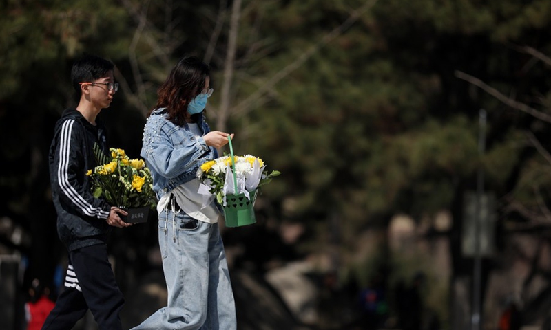 People prepare to lay flower baskets to the monument at the Chinese People's Volunteers (CPV) martyrs' cemetery in Shenyang, capital of northeast China's Liaoning Province, April 4, 2021.(Photo: Xinhua)