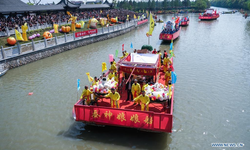 A festive boat procession in worship of Canshen, the local patron god of silkworm raisers, is seen during a temple fair at Qinghe Village, Zhouquan Township, Tongxiang City of east China's Zhejiang Province, April 4, 2021.(Photo: Xinhua)