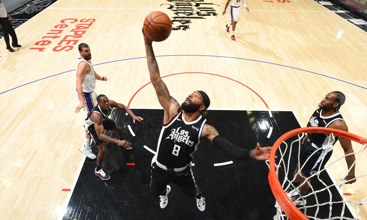 Marcus Morris of the Los Angeles Clippers grabs a rebound during the game against the Los Angeles Lakers on Sunday in Los Angeles. Photo: VCG