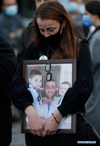 Family members of the victims of the Beirut port explosion stage a sit-in and demand for expediting investigation in Beirut, Lebanon, April 4, 2021. Two huge explosions ripped through the port of Beirut on Aug. 4, 2020, killing about 200, injuring at least 6,000 and leaving 300,000 homeless.(Photo: Xinhua)