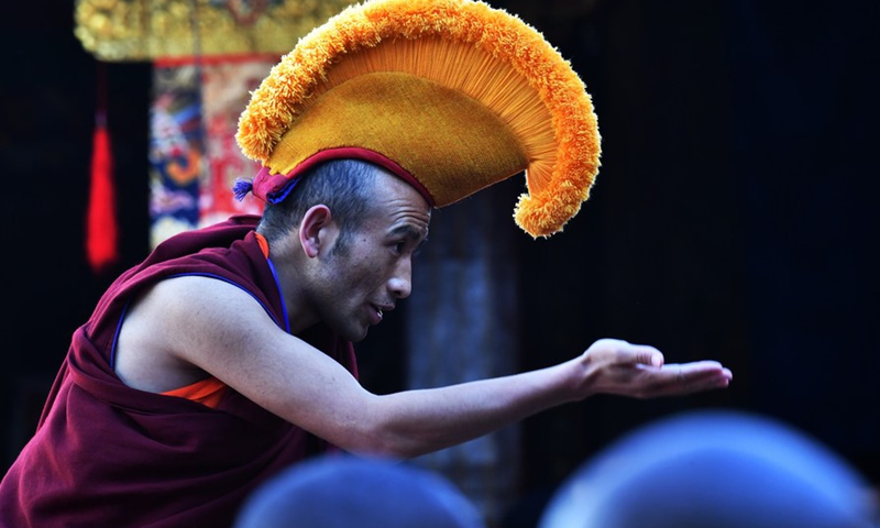 A monk attends the debate activity, a part of the award ceremony of the degree of Geshe Lharampa held in the Jokhang Temple in Lhasa, capital of southwest China's Tibet Autonomous Region, April 5, 2021.(Photo: Xinhua)