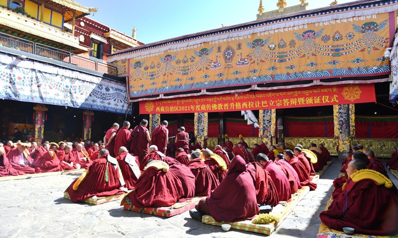 Monks attend the award ceremony of the degree of Geshe Lharampa held in the Jokhang Temple in Lhasa, capital of southwest China's Tibet Autonomous Region, April 5, 2021.(Photo: Xinhua)