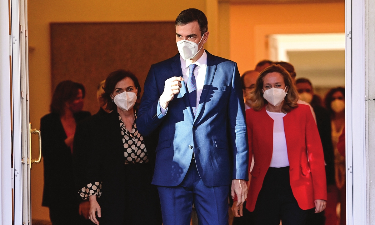 Spain's Prime Minister Pedro Sanchez (center) arrives to pose for a family photo with his ministers before a cabinet meeting at the Moncloa Palace in Madrid, Spain on Tuesday. Photo: AFP