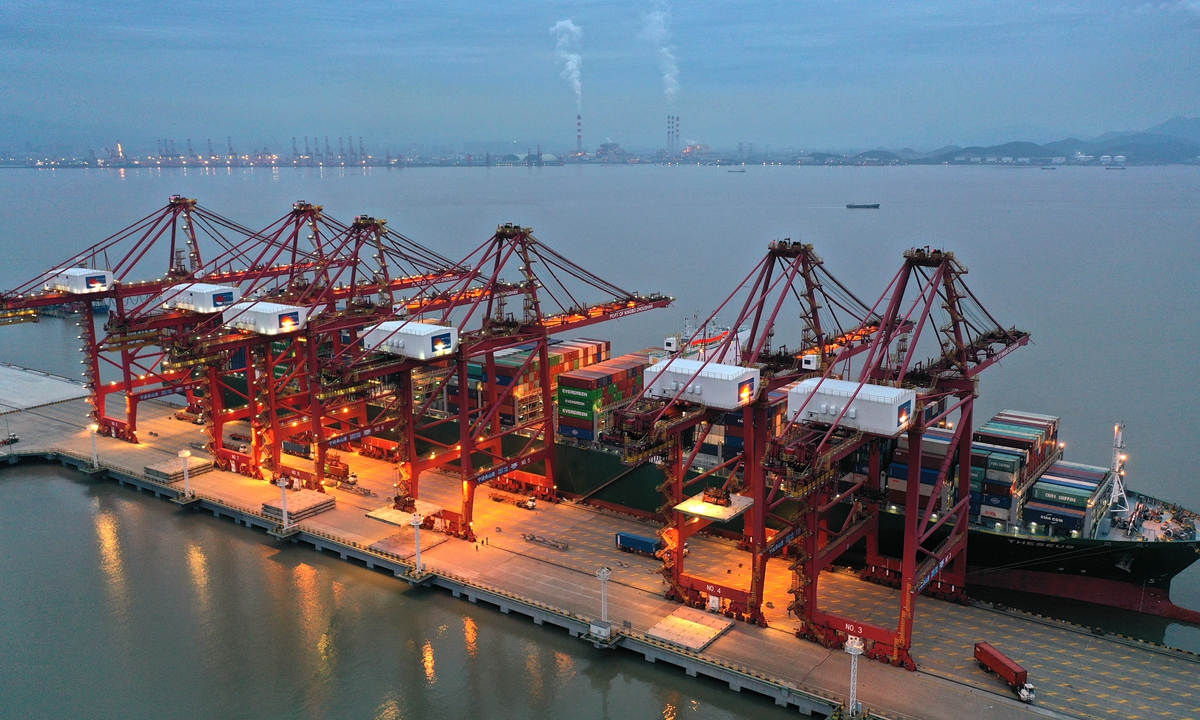 A ship berths at Ningbo Zhoushan port on Tuesday. Official data showed that Ningbo Zhoushan port handled cargo throughput of 193.34 million tons in January and February, a year-on-year increase of 18.4 percent. Photo:cnsphoto