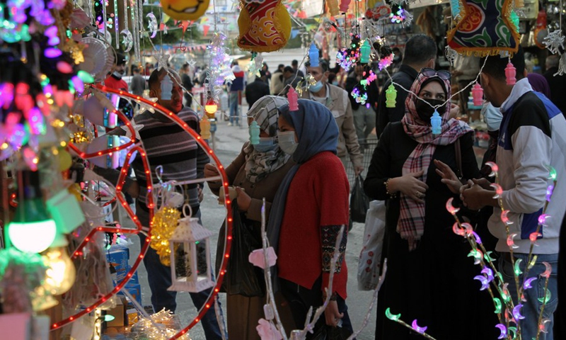 Palestinians visit a market ahead of the Islamic holy month of Ramadan in Gaza City, on April 4, 2021.(Photo: Xinhua)