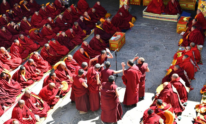 Monks attend the debate activity, a part of the award ceremony of the degree of Geshe Lharampa held in the Jokhang Temple in Lhasa, capital of southwest China's Tibet Autonomous Region, April 5, 2021.(Photo: Xinhua)