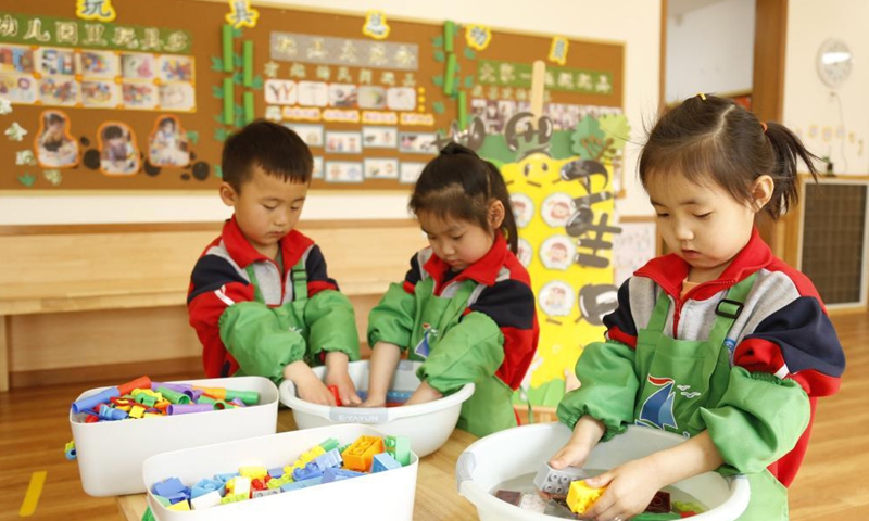 Children wash toys at a kindergarten on the occasion of World Health Day in Xingtai City, north China's Hebei Province, April 7, 2021. (Photo:Xinhua)