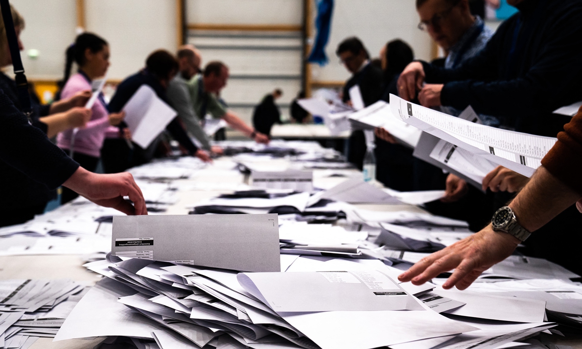 Electoral workers count ballots during legislative elections in Nuuk, Greenland, on Tuesday. Greenland went to the polls on Tuesday after an election campaign focused on a disputed mining project in the autonomous Danish territory, as the Arctic island confronts the impact of global warming. Photo: AFP