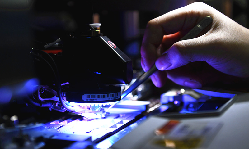 Workers make chips at Anhui Dongke Semiconductor Co in East China's Anhui Province on Saturday. The company is located in the Anhui Ma'anshan Economic and Technological Development Zone, and it is mainly engaged in the design, production and sales of green power chips. Photo: VCG