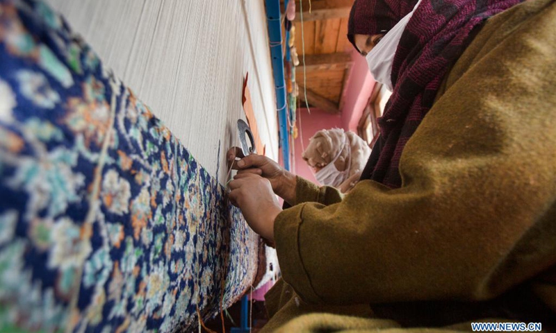 People work at a carpet-weaving workshop in Kokernag village of Anantnag district in Srinagar city, the summer capital of Indian-controlled Kashmir, April 7, 2021.(Photo: Xinhua)