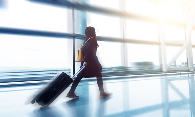 A passenger walks in an airport terminal. Photo: VCG