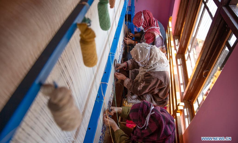 People work at a carpet-weaving workshop in Kokernag village of Anantnag district in Srinagar city, the summer capital of Indian-controlled Kashmir, April 7, 2021.(Photo: Xinhua)