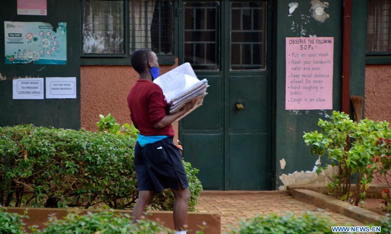 A student walks at a primary school in Kampala, Uganda, April 6, 2021. Uganda reopened classes on Tuesday for students in their fourth and fifth grades at primary schools. In March of 2020, the country closed all schools and education institutions to curb the spread of COVID-19.(Photo: Xinhua)