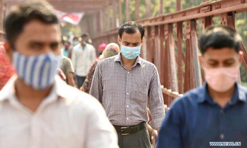 People wearing face masks are seen during a nationwide lockdown amid a recent surge in COVID-19 cases in Dhaka, Bangladesh, April 7, 2021. Bangladesh's Directorate General of Health Services (DGHS) on Wednesday reported 7,626 new COVID-19 infections, the highest increase in a single day since the pandemic started in the country. To control the new COVID-19 wave in the country, the Bangladeshi government on Monday enforced a one-week lockdown.(Photo: Xinhua)