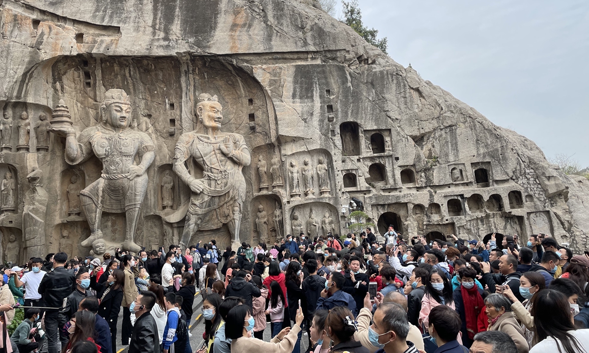 Tourists at the Longmen Grottoes in Luoyang, Henan Province on April 4 Photo: VCG
