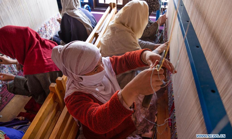 People work at a carpet-weaving workshop in Kokernag village of Anantnag district in Srinagar city, the summer capital of Indian-controlled Kashmir, April 7, 2021.(Photo: Xinhua)