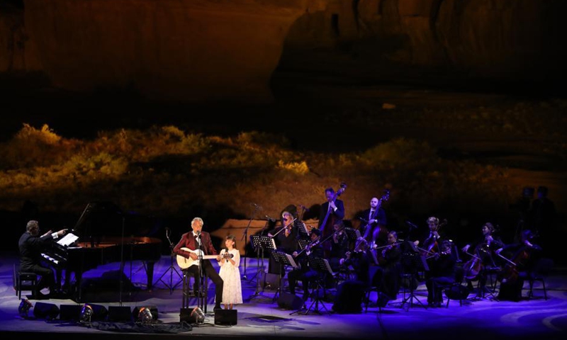 Italian tenor Andrea Bocelli performs with his daughter Virginia at a concert in Al-Ula, northwestern Saudi Arabia, April 8, 2021. The Italian legendary tenor Andrea Bocelli on Thursday evening performed within the walls of Hegra, Saudi Arabia's first UNESCO World Heritage Site.  Photo: Xinhua