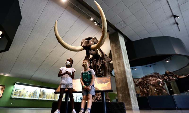 Children visit the La Brea Tar Pits and Museum in Los Angeles, California, the United States, on April 8, 2021. After more than a year of COVID-19 closure, the La Brea Tar Pits and Museum in Los Angeles reopened to the public on Thursday. Museums, galleries, botanical gardens, zoos and aquariums in Los Angeles County are allowed to reopen their indoor spaces to the public at 50 percent maximum indoor occupancy after the county enters the Orange Tier.Photo:Xinhua