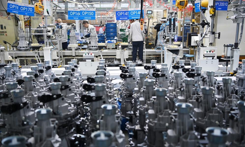 Workers operate at a workshop of the Dongan Auto Engine Co., Ltd. in Harbin City of northeast China's Heilongjiang Province, April 9, 2021. The Dongan Auto Engine Co., Ltd. sold about 120,000 automotive engines in the first quarter of 2021, up by 101.57 percent year-on-year, marking a benign start. Photo: Xinhua