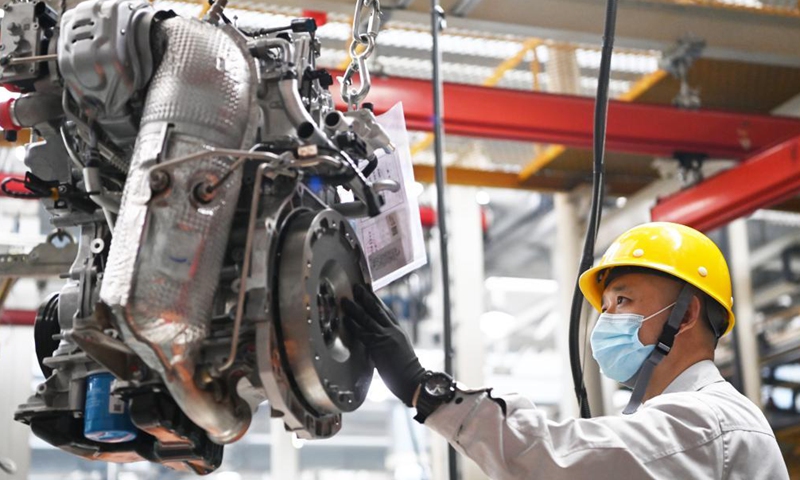 A worker operates at a workshop of the Dongan Auto Engine Co., Ltd. in Harbin City of northeast China's Heilongjiang Province, April 9, 2021. The Dongan Auto Engine Co., Ltd. sold about 120,000 automotive engines in the first quarter of 2021, up by 101.57 percent year-on-year, marking a benign start. Photo: Xinhua