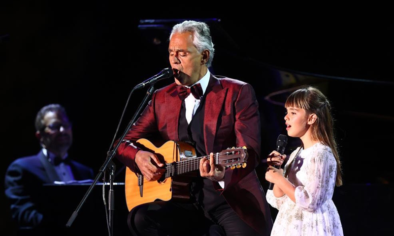Italian tenor Andrea Bocelli performs with his daughter Virginia at a concert in Al-Ula, northwestern Saudi Arabia, April 8, 2021. The Italian legendary tenor Andrea Bocelli on Thursday evening performed within the walls of Hegra, Saudi Arabia's first UNESCO World Heritage Site. Photo: Xinhua