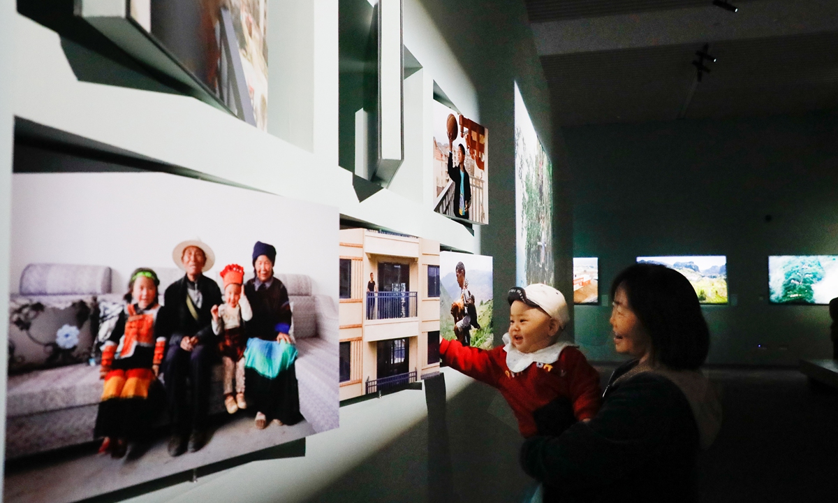 Visitors explore <em>The Field of Hope</em> exhibition. 
Photo: Courtesy of China Photographers Association