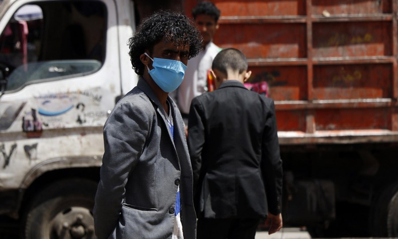 A Yemeni wearing a face mask is seen in a street of Sanaa, Yemen on April 10, 2021.(Photo: Xinhua)