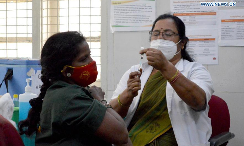 A woman receives a dose of COVID-19 vaccine during the vaccination drive in Bangalore, India, Feb. 12, 2021.(Photo:Xinhua)