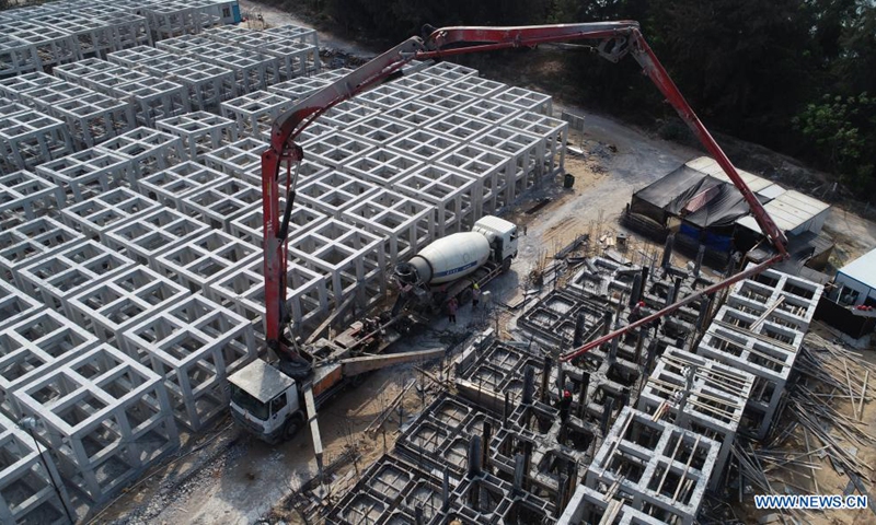 In this aerial photo taken on March 9, 2021, workers pour concrete into artificial reefs on Wuzhizhou Island in Sanya City, south China's Hainan Province. Wuzhizhou Island has launched a comprehensive drive to build a marine ranch and restore the marine ecosystem, by placing artificial reefs under the sea and transplanting corals. (Photo: Xinhua)