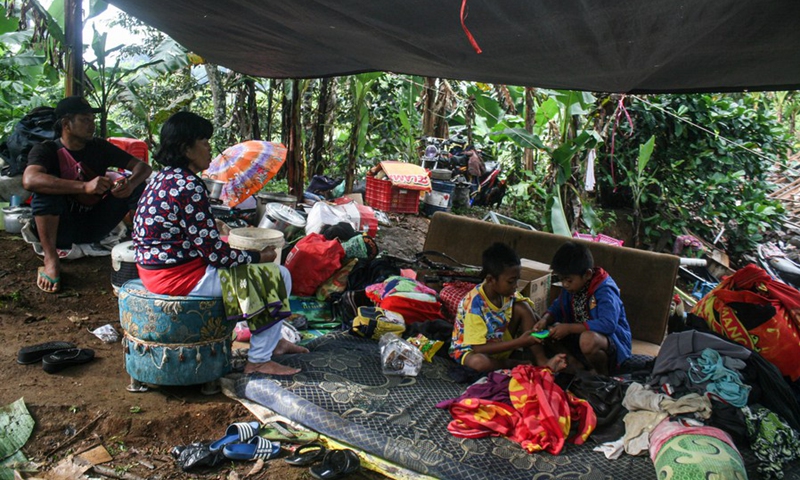 People take a rest in a temporary shelter after a 6.1 magnitude quake hit Kali Uling village in Lumajang, East Java, Indonesia, April 11, 2021.(Photo: Xinhua)