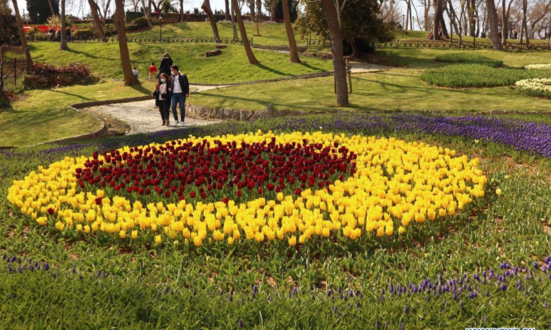 People stroll in a park in Istanbul, Turkey, April 12, 2021. (Xinhua/Xu Suhui)