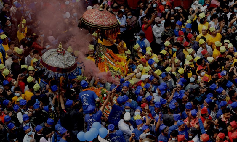 Nepalese devotees from the ethnic Newar community parade to celebrate the Pahchare Chariot Festival, locally known as Daya Lyagu, in Kathmandu, Nepal, April 12, 2021.(Photo: Xinhua)