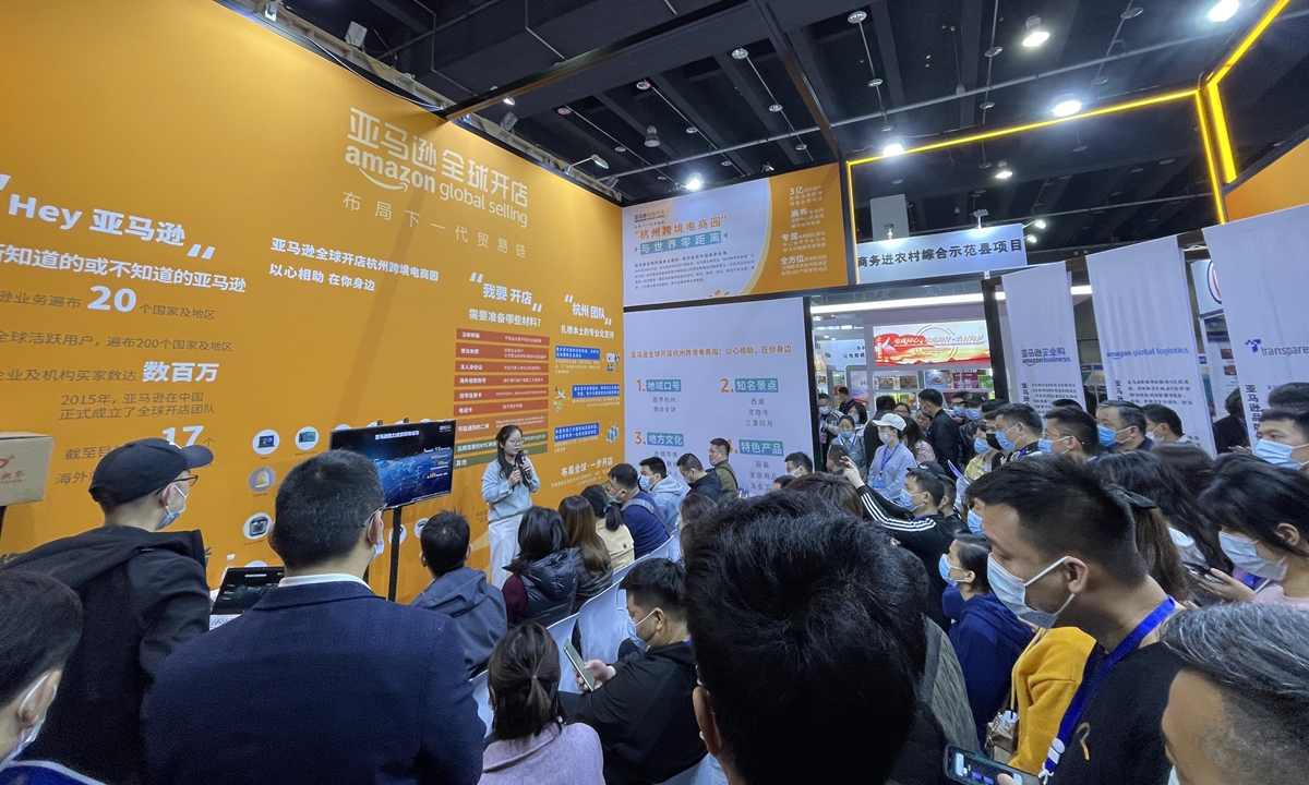 A representative from Amazon introduces to visitors on how to start e-commerce businesses overseas at the 2021 international e-commerce expo in Yiwu, East China's Zhejiang Province. Photo: Yu Xi/GT 