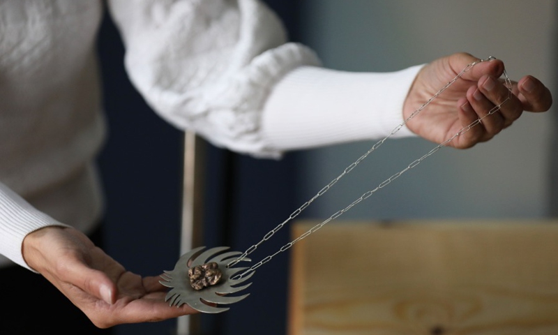 A Palestinian Rawan Raafat from East Jerusalem displays traditional Palestinian jewelry at her own shop on April 12, 2021. (Photo: Xinhua)