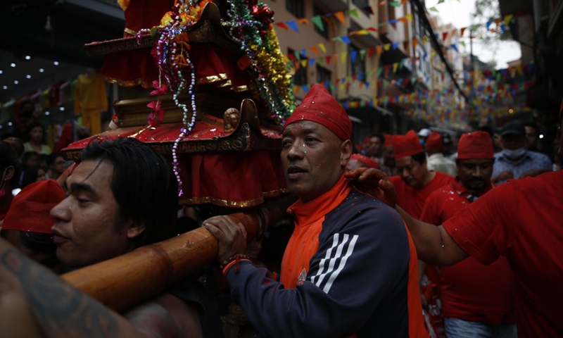 A devotee participates in the Pahchare Chariot Festival in Kathmandu, Nepal, April 12, 2021.(Photo: Xinhua)