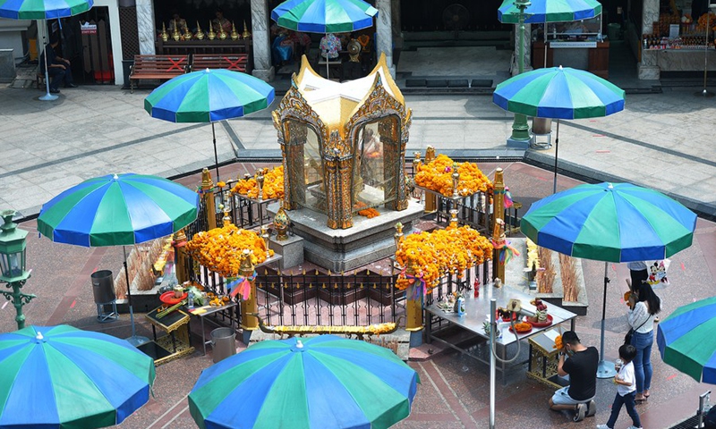 People pray at the Erawan Shrine during the Songkran festival in Bangkok, Thailand, April 13, 2021.(Photo: Xinhua)