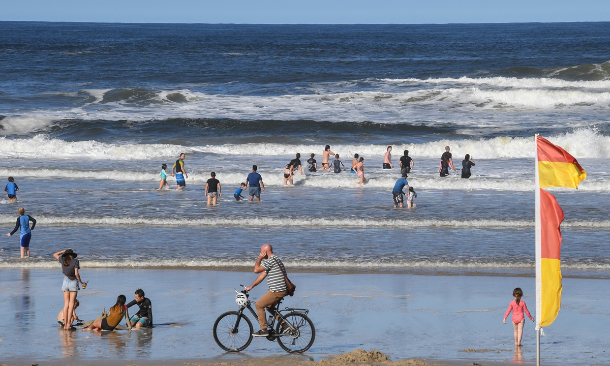 People gather at Seven Mile Beach on April 9 in Lennox Head, Australia. Photo: VCG