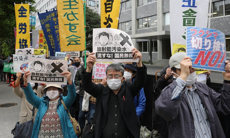 People rally to protest against the Japanese government's decision to discharge contaminated radioactive wastewater in Fukushima Prefecture into the sea, in Tokyo, capital of Japan, April 13, 2021.(Photo: Xinhua)
