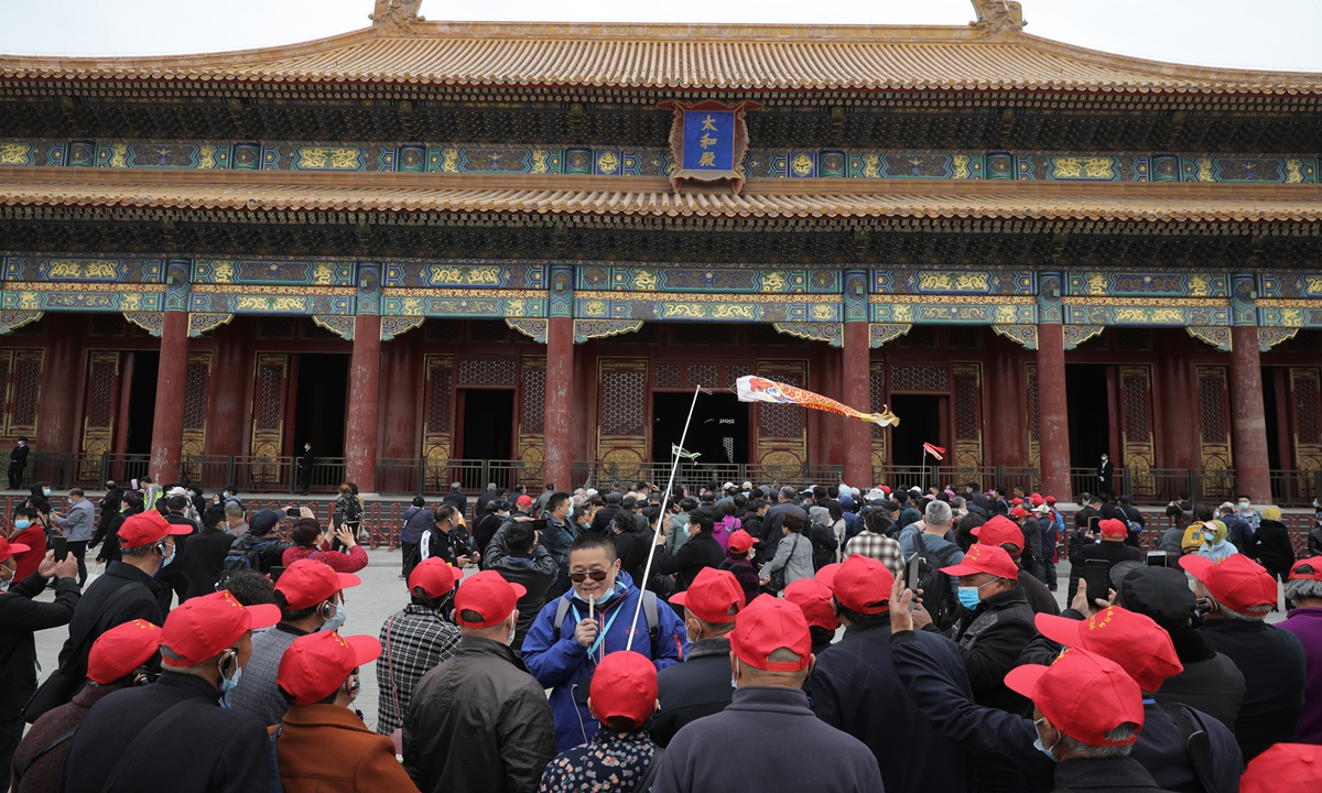 Tourists visit Beijing's Palace Museum on Friday, after the city was attacked by a new round of sandstorm on Thursday. Photo: VCG
