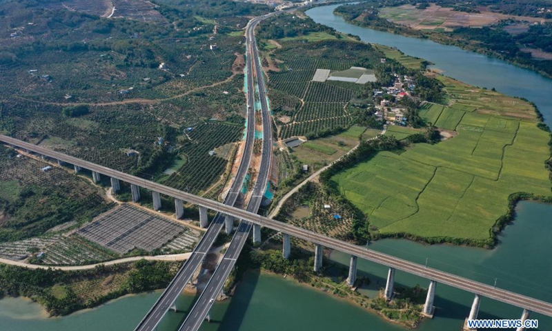 Aerial photo taken on Dec. 30, 2020 shows a view of a section of Wuzhishan-Haitangwan Expressway in south China's Hainan Province. Hainan has made significant progress in the construction of expressway since the 13th Five-Year Plan, which started in 2016. By far, the total mileage of expressways in the province has reached 1,255 kilometers. The transport upgrade will help boost the building of Hainan into an international tourism and consumption center.Photo:Xinhua