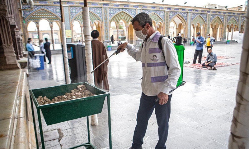 A worker disinfects the shrine of Shah Abdulazim during the holy month of Ramadan in Shahr-e Rey, south of Tehran, Iran, April 19, 2021.  Photo: Xinhua 